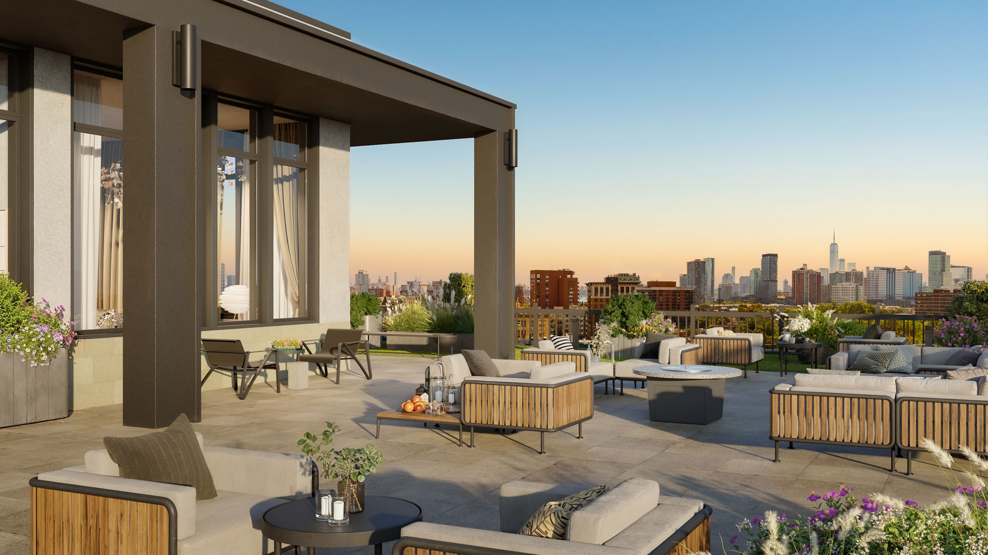 A rooftop lounging area with a skyline view, various seating spaces, a firpit and plant decor